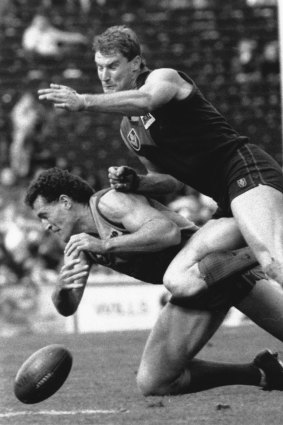 Danny Hughes of Melbourne and Ross Glendinning of West Coast compete for the ball.