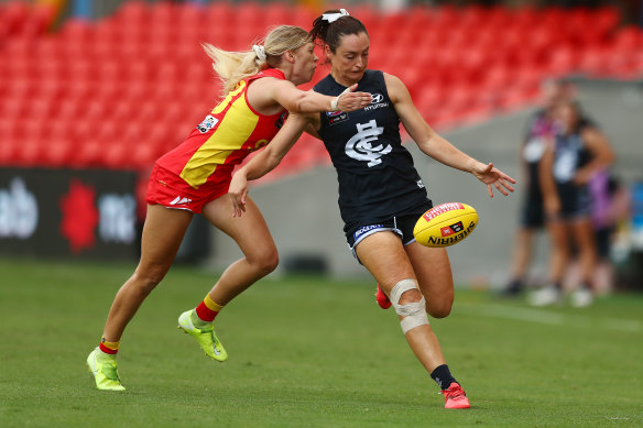 Nicola Stevens gets a kick away for the Blues at Metricon Stadium on Friday night.