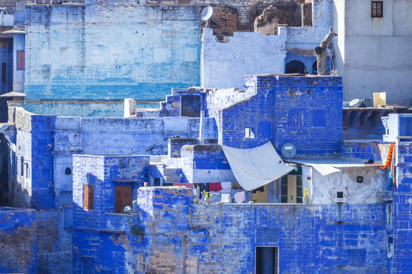 Jodhpur or “India’s Blue City” where the city’s high-caste Brahmins have painted their houses with indigo wash .