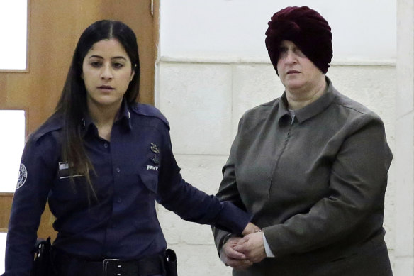 Malka Leifer, right, is brought to a courtroom in Jerusalem in 2018.