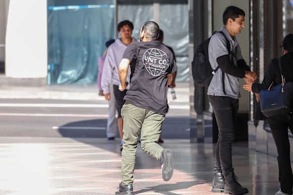 Sacked transport official Ibrahim Helmy runs from the Downing Centre on Thursday after his sentencing.