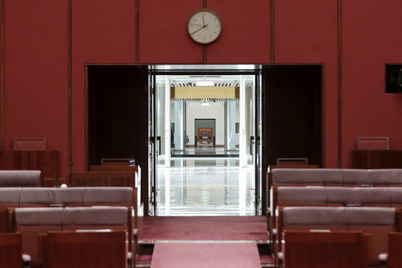 The chambers are separated by a vast Members' Hall with a low black granite "reflective pool" in the middle.