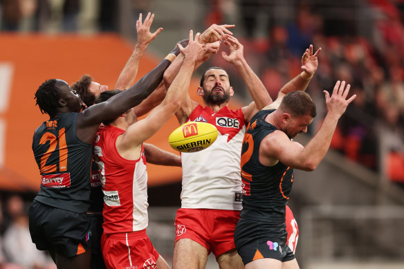 Brodie Grundy of the Swans contests the ball.