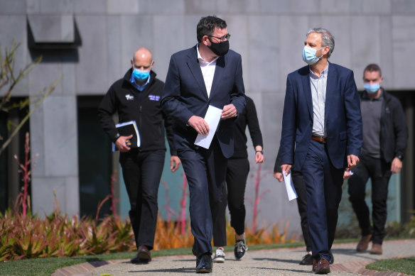 Victoria’s COVID-19 response commander Jeroen Weimar (left) walks behind Premier Daniel Andrews and Chief Health Officer Brett Sutton.