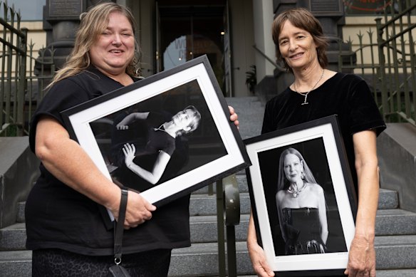 Photographer Suzanne Phoenix and Spiderbait bass guitarist and singer Janet English, who holds a photograph of Carol Green.