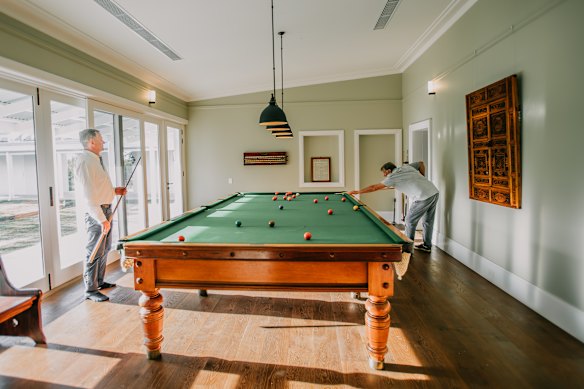 A billiard table in what was once a kitchen.