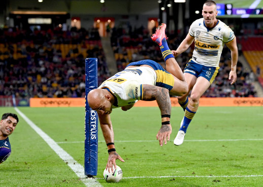 Eels winger Blake Ferguson takes the aerial route to the try line.