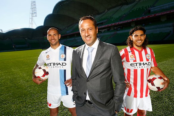 Same coach, new colours: John van ’t Schip with Patrick Kisnorbo (left) and David Williams in Melbourne City’s relaunched jerseys in 2014.