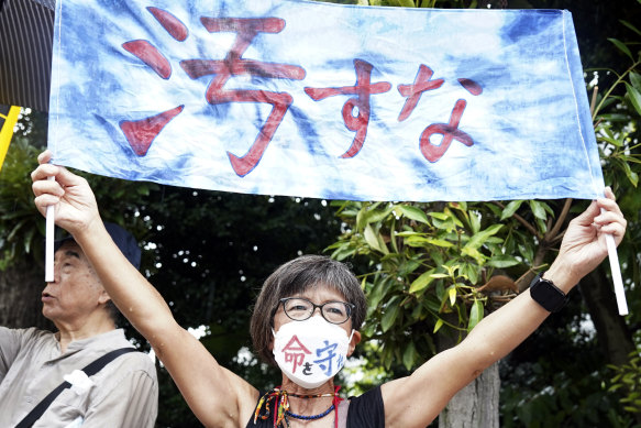 One of protesters holds a poster saying in Japanese “Don’t make it dirty!” during a rally against the treated radioactive water release from the damaged Fukushima nuclear power plant, in front of the Prime Minister’s office in Japan.
