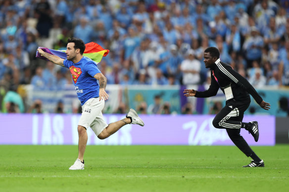 A protester enters the pitch during Portugal’s World Cup clash with Uruguay in Lusail.