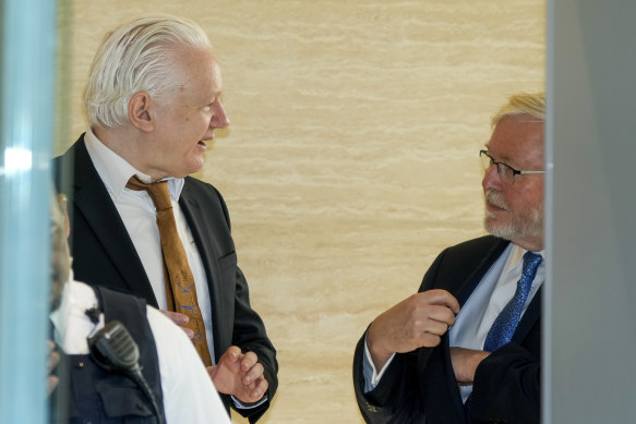 Assange speaks with Australian ambassador to the US Kevin Rudd on Wednesday.