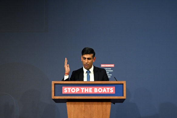 British Prime Minister Rishi Sunak speaks from his “Stop the boats” lectern.