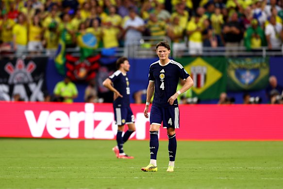 Scott McTominay reacts after Scotland concede a third Brazil goal.
