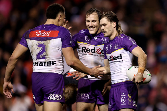 Ryan Papenhuyzen of the Storm celebrates with teammates at full-time.