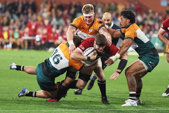 Scott Cummings of the British & Irish Lions scores a try during the rugby match between the Lions and the AUNZ Invitational XV.