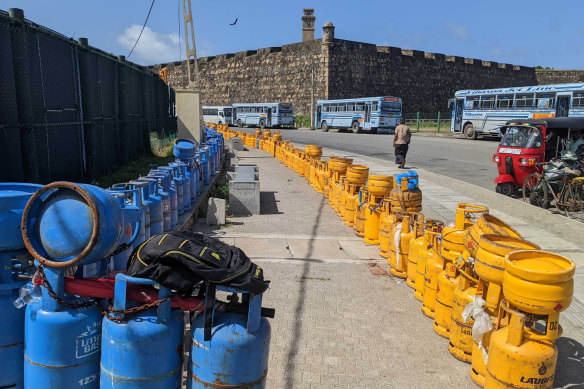 Gas bottles stacked up in protest around the southern end of Galle cricket stadium.