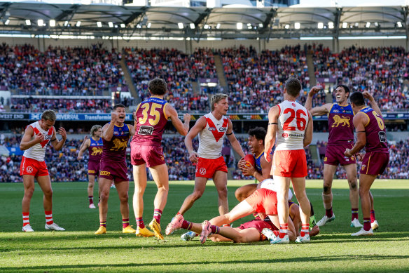 Brisbane celebrate their seventh straight win.