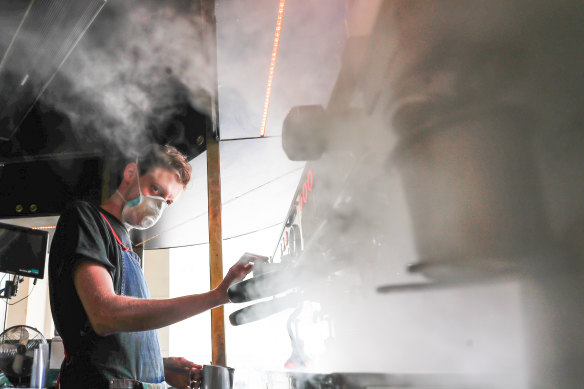 Steam and smoke: barista Alex Cooper at work on the GPO Building porch. 