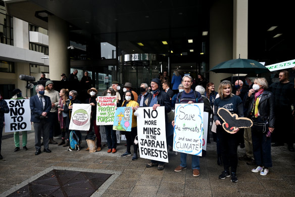 Protesters from environmental groups chant outside Perth’s central law courts ahead of a warden’s court hearing for objections to Rio Tinto’s exploration of the Northern Jarrah Forest.