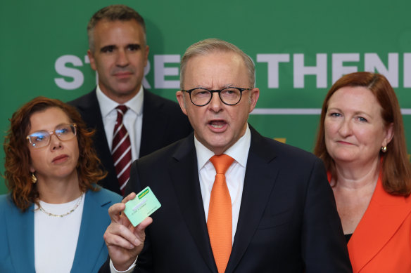 Anthony Albanese’s Medicare card has been a constant presence on the campaign trail. He’s pictured here with it in Adelaide on April 1.
