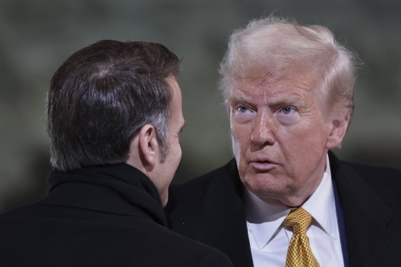 President-elect Donald Trump is greeted by French President Emmanuel Macron in Paris on Saturday.