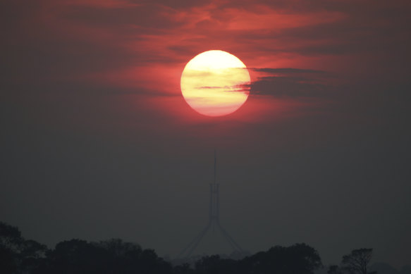 Sunrise through thick smoke over Parliament House in Canberra in December 2019.