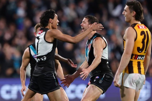 Jase Burgoyne of the Power celebrates a goal.