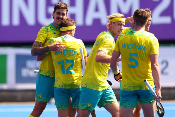 Blake Govers of Team Australia celebrates with team mate Jake Whetton after scoring their sides first goal.