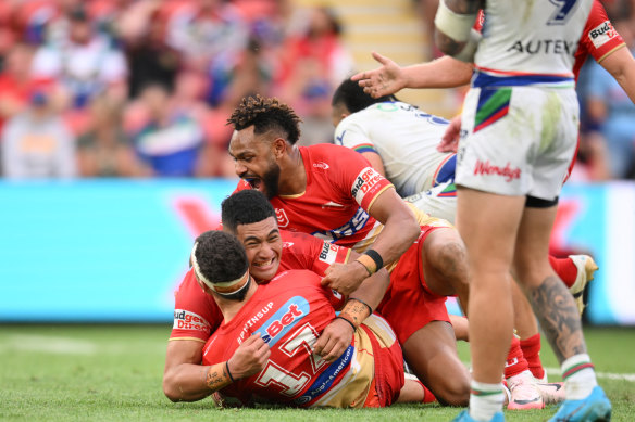 Sean O’Sullivan is mobbed by Isaiya Katoa and Hamiso Tabuai-Fidow after kicking the golden point field goal.