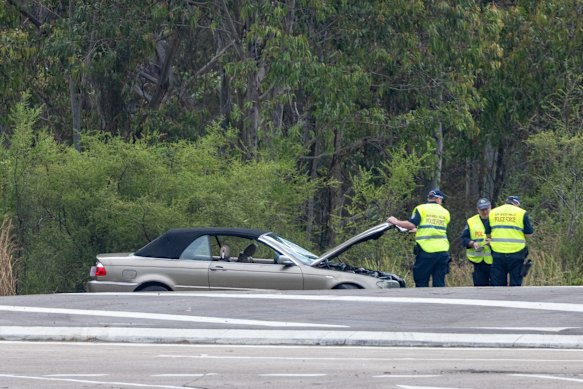 Police inspect the car allegedly involved in the incident at Wallsend in Newcastle.