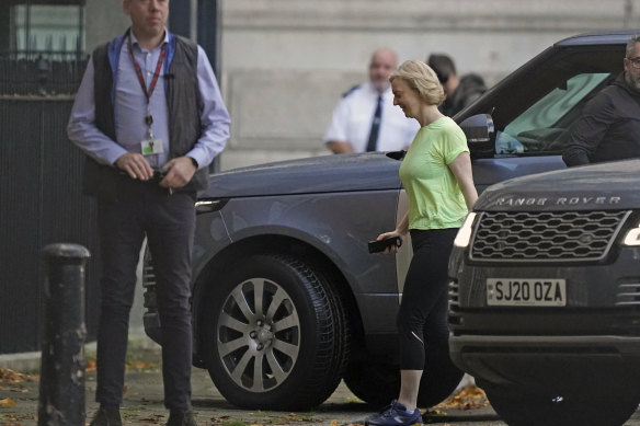 Liz Truss arrives in Downing Street in London, Friday, a day after resigning.