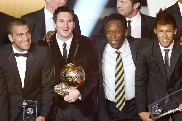 Brazil’s Dani Alves, Argentina’s Lionel Messi, Brazil’s soccer legend Pele and Brazil’s Neymar, from left, stand together after Messi was awarded the prize for the soccer player of the year 2011 at the FIFA Ballon d’Or ceremony in Zurich.