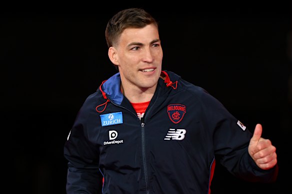 Jack Viney of the Demons runs out to warm up.