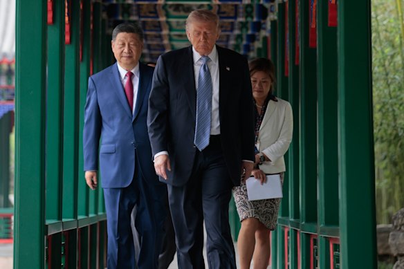 Xi and Trump participate in a “friendship walk” through Zhongnanhai Garden.