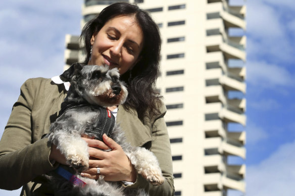 Horizon apartments resident Jo Cooper with her miniature Schnauzer Angus.