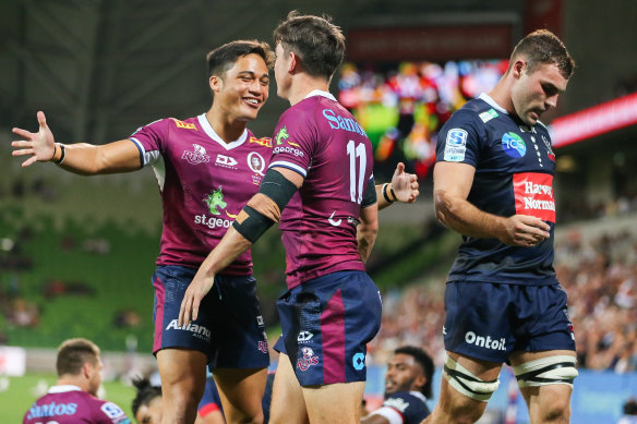 Kalani Thomas congratulates try scorer Jock Campbell.