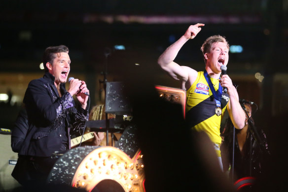 A more popular choice: Jack Riewoldt gets on stage with The Killers after 2017 grand final at the MCG.