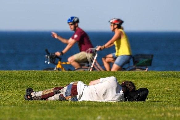 Victorians flocked to the St Kilda foreshore early on New Year’s Day for energetic bike rides and snoozes in the sun.