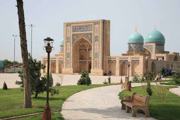 The 16th-century Barakhan Madrasah in Tashkent, Uzbekistan is renowned for its tile-decorated portal and turquoise domes.