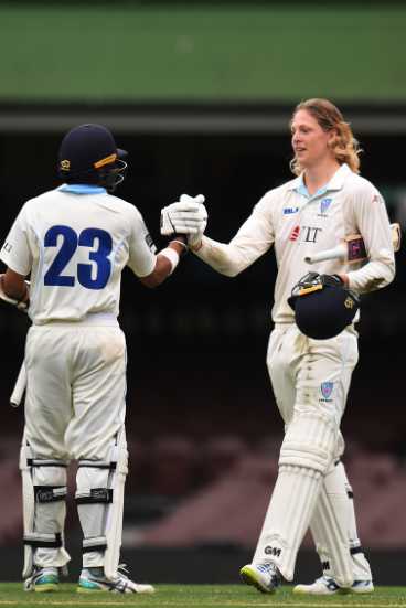 Centurions: Jack Edwards (right) is congratulated by Sangha after reaching his own milestone.