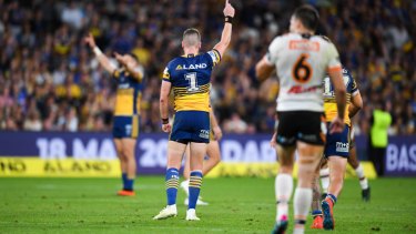 Celebration: off-contract stars Mitchell Moses and Clint Gutherson salute their efforts on Monday.