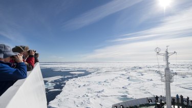 Tourists in the Arctic Ocean in summer. Scientists are hoping to spend a year in a special research vessel in the ice.