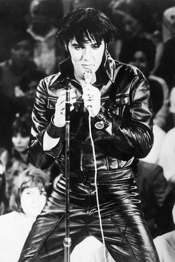 Greg loves the Elvis look – black leather, bomber jacket – and even 
has a pair of blue suede shoes.