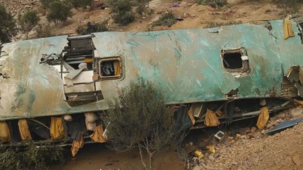 A crashed bus lays on the bottom of a cliff in Arequipa, Peru, killing at least 44. 