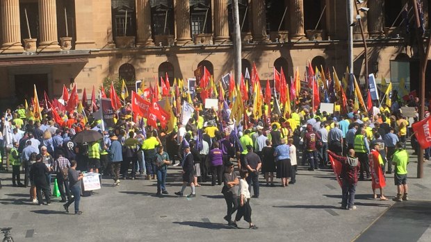 Unions go on strike outside City Hall.