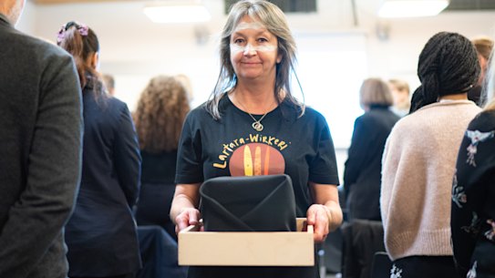 Robyn Campbell, a Bunganditj, Meintangk and Tanganekald woman from South Australia, carries the remains of an ancestor from a repatriation ceremony at Oxford University.