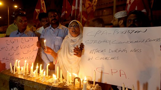 Pakistanis hold a vigil for the for victims of the Sri Lanka attacks, in Karachi, Pakistan.
