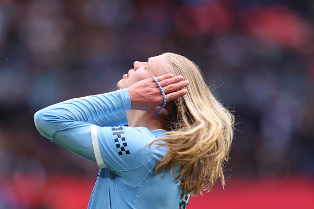 Erling Haaland of Manchester City ties his hair during the Emirates FA Cup Final match between Chelsea and Manchester City at Wembley Stadium on May 16, 2026 in London, England.