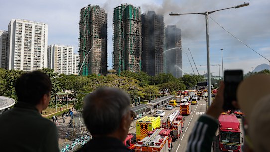 Fire services continue rescue efforts at affected buildings in Tai Po District, Hong Kong. Photo: Daniel Ceng .