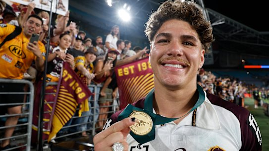 Reece Walsh celebrates his Clive Churchill Medal win after Sunday’s grand final.